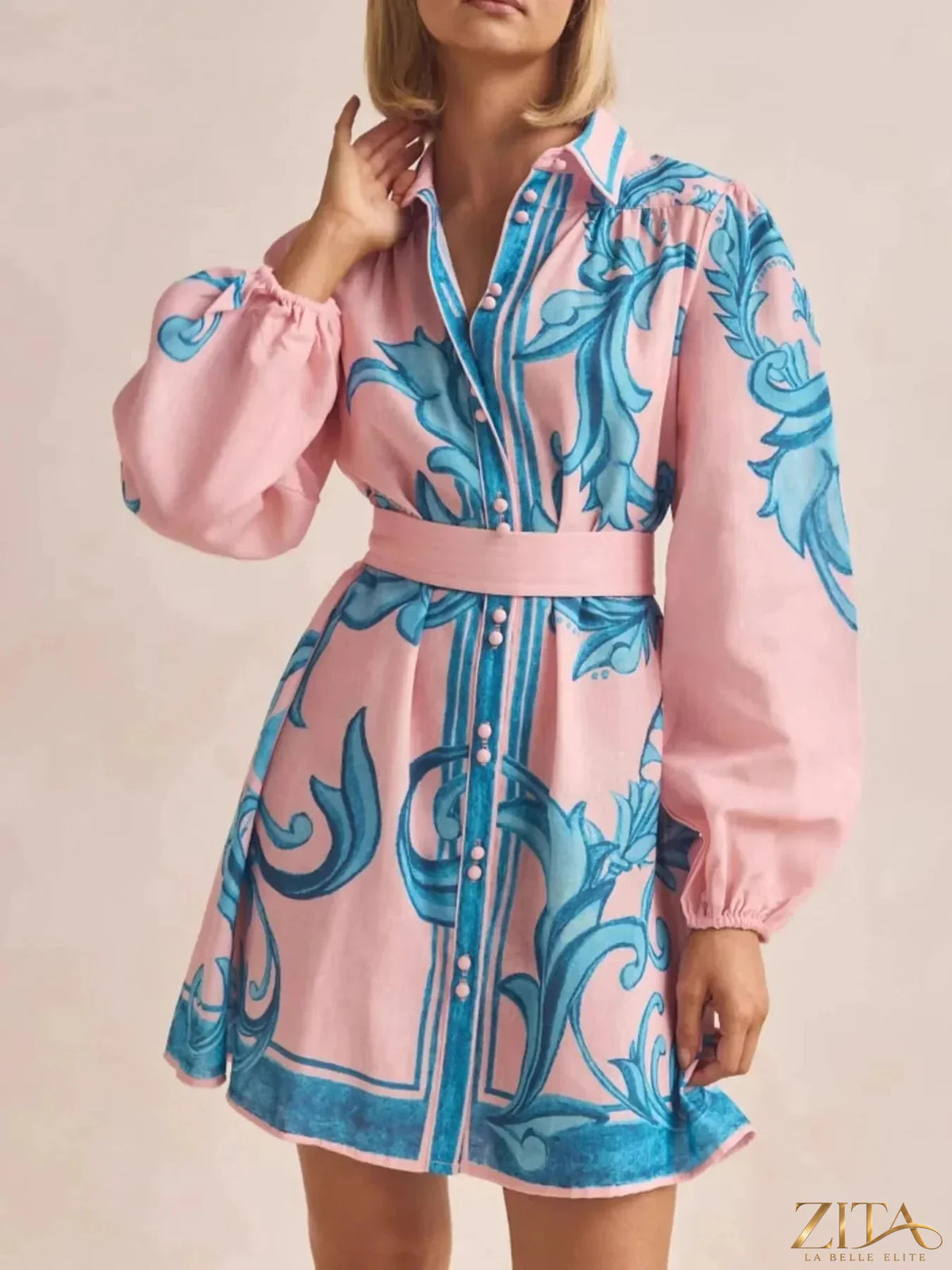Printed long sleeve shirt dress from Trendsi featuring a stylish design and comfortable fit, shown on a model.