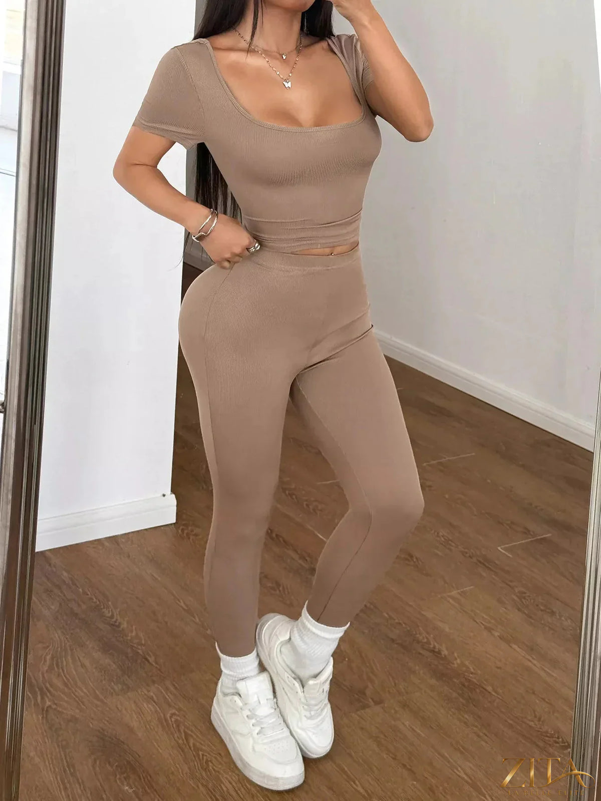 Trendsi short sleeve top and leggings set featuring a stylish casual outfit for women, with a comfortable fit and modern design.