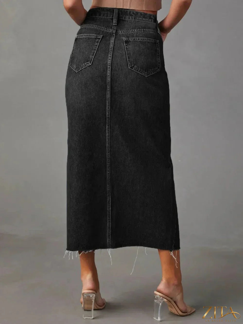 Raw hem front slit denim midi skirt by Zita La Belle Elite, showcasing a stylish slit detail and casual denim fabric.