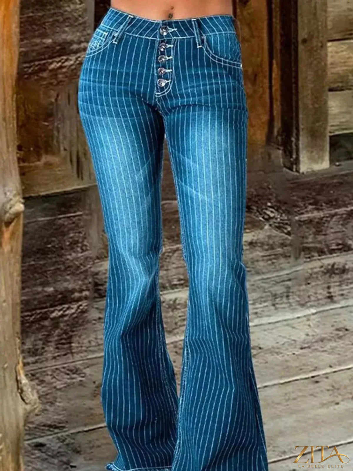 Zita La Belle Elite striped button fly flare jeans with high waist and bold vertical stripes, shown on a model.