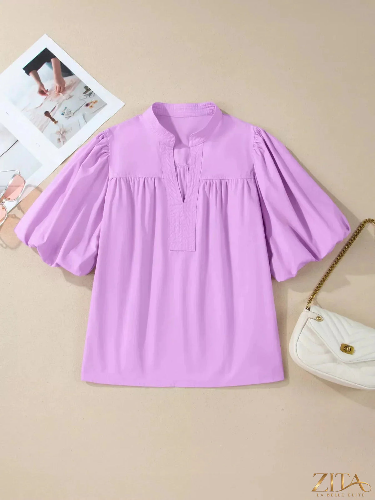 Zita La Belle Elite notched puff sleeve blouse featuring ruffled details and lightweight fabric, stylish and feminine for casual or dressy wear.
