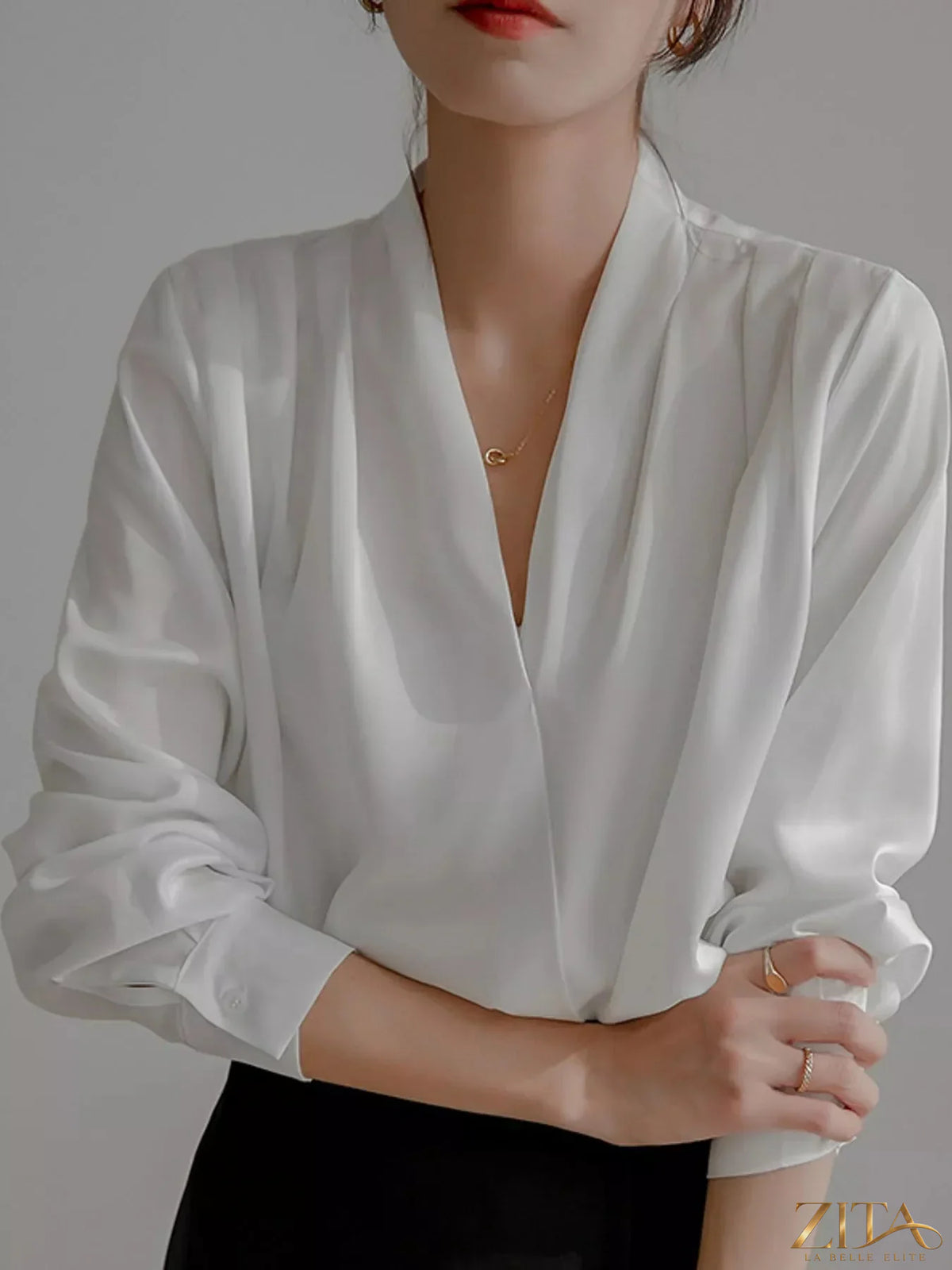 Zita La Belle Elite long sleeve satin blouse in elegant black, featuring a sleek, shiny fabric and classic fit.