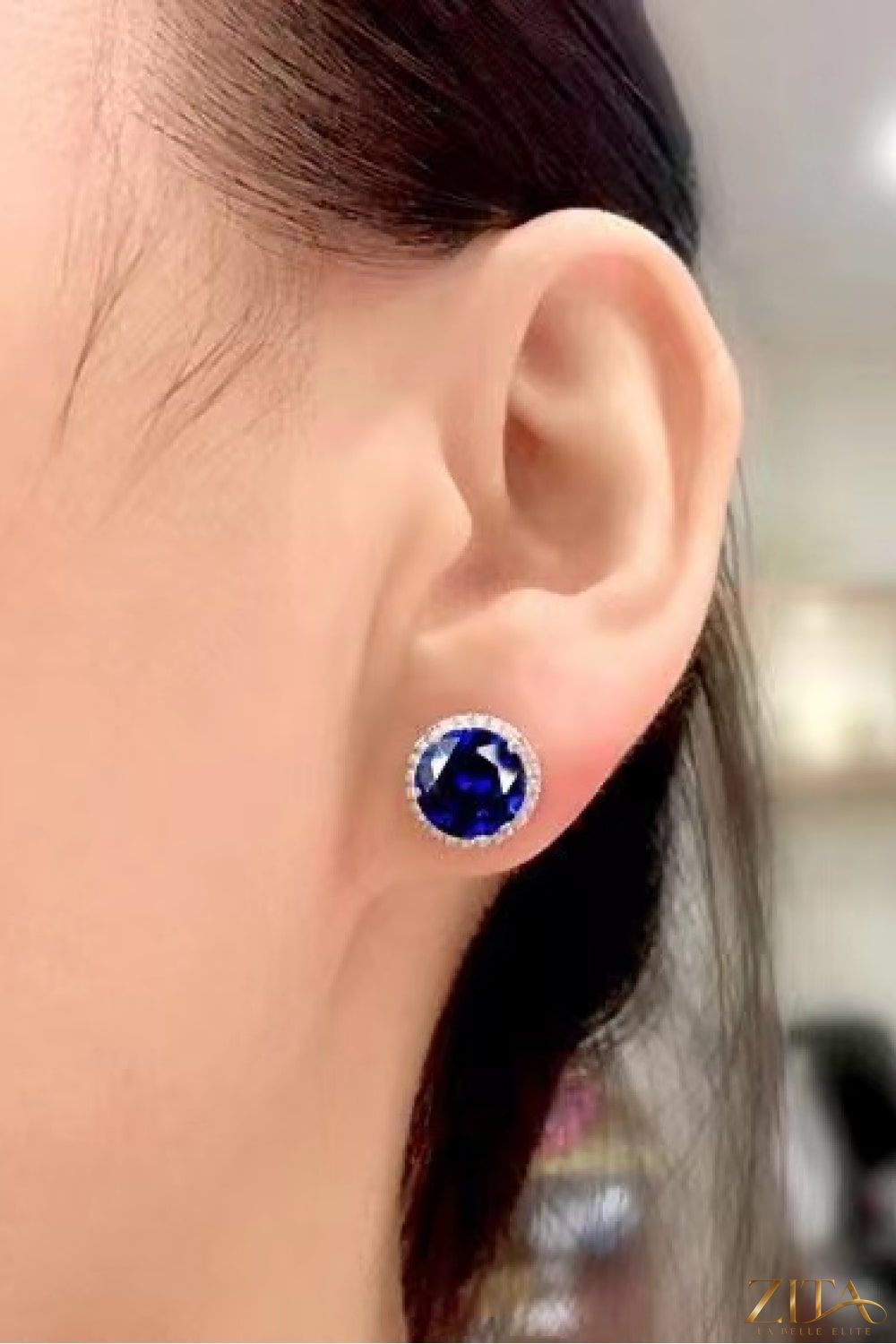 Contrast 2 Carat Moissanite platinum-plated stud earrings with sparkling gemstone accents, showcased on a white background.
