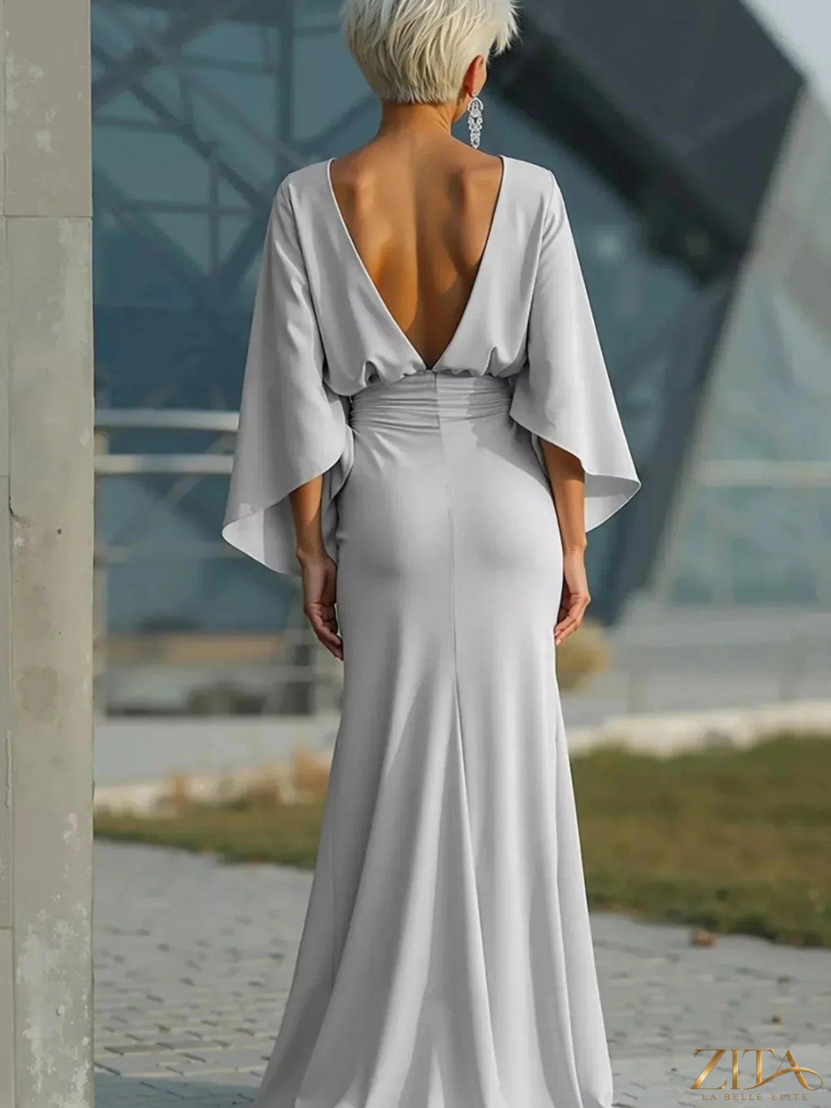 Zita La Belle Elite batwing sleeve ruched maxi dress shown on model, featuring flowing fabric and elegant design.