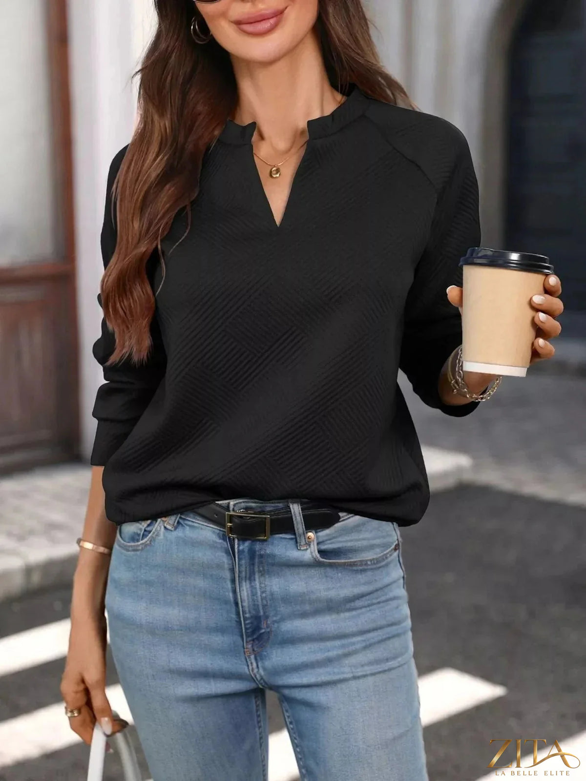 Zita La Belle Elite textured notched long sleeve sweatshirt with ribbed cuffs and hem, casual style, in a neutral color.