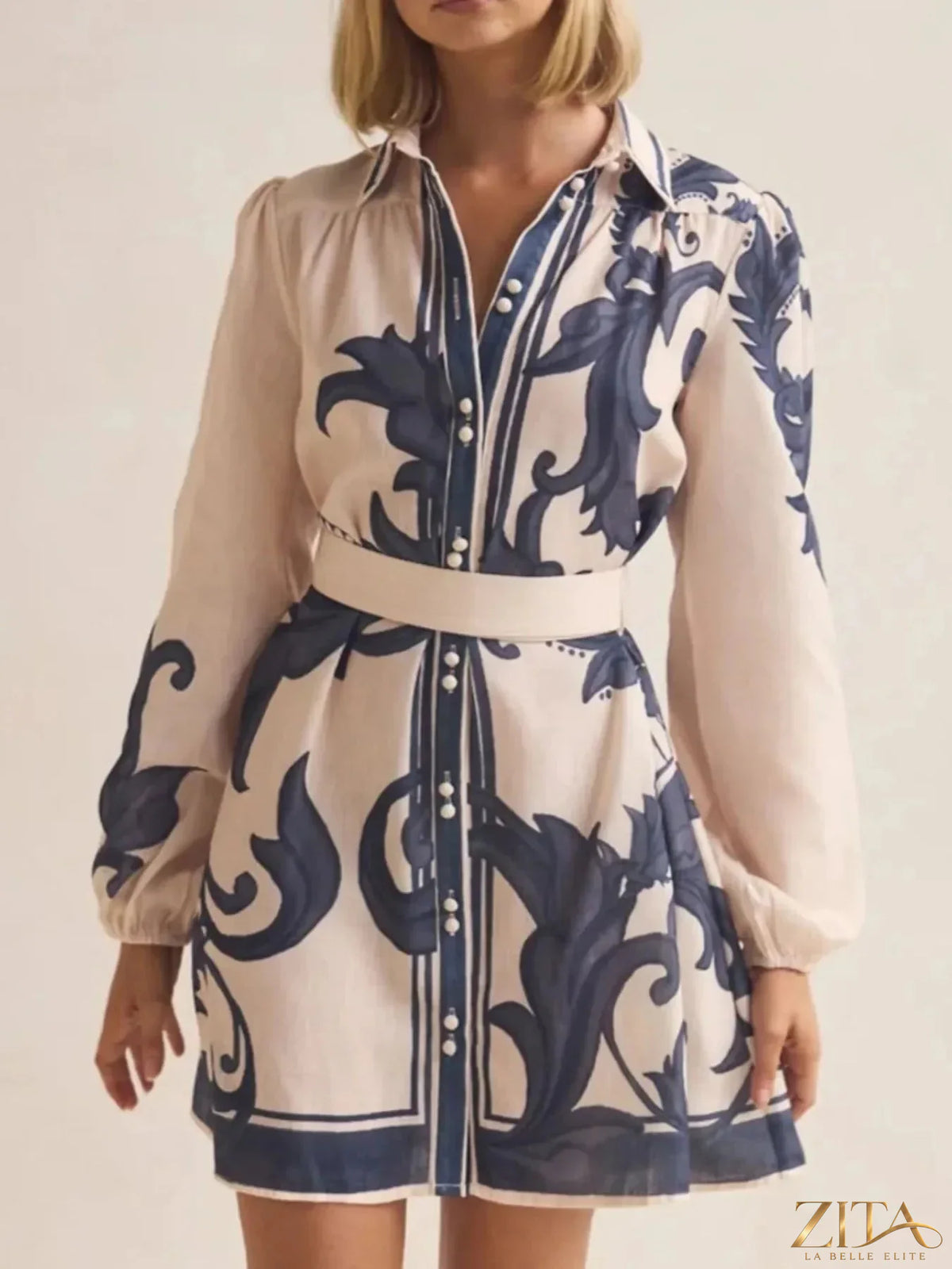 Printed long sleeve shirt dress by Trendsi featuring a stylish pattern, button-front design, and a comfortable, flowy fit.