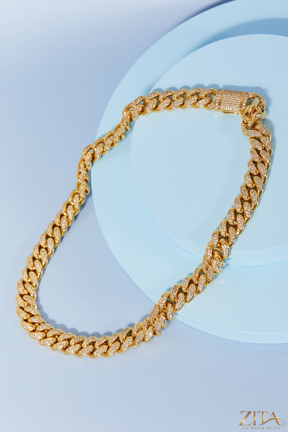 Brass curb chain necklace featuring chunky interlinked loops, stylish jewelry accessory with a shiny gold finish.