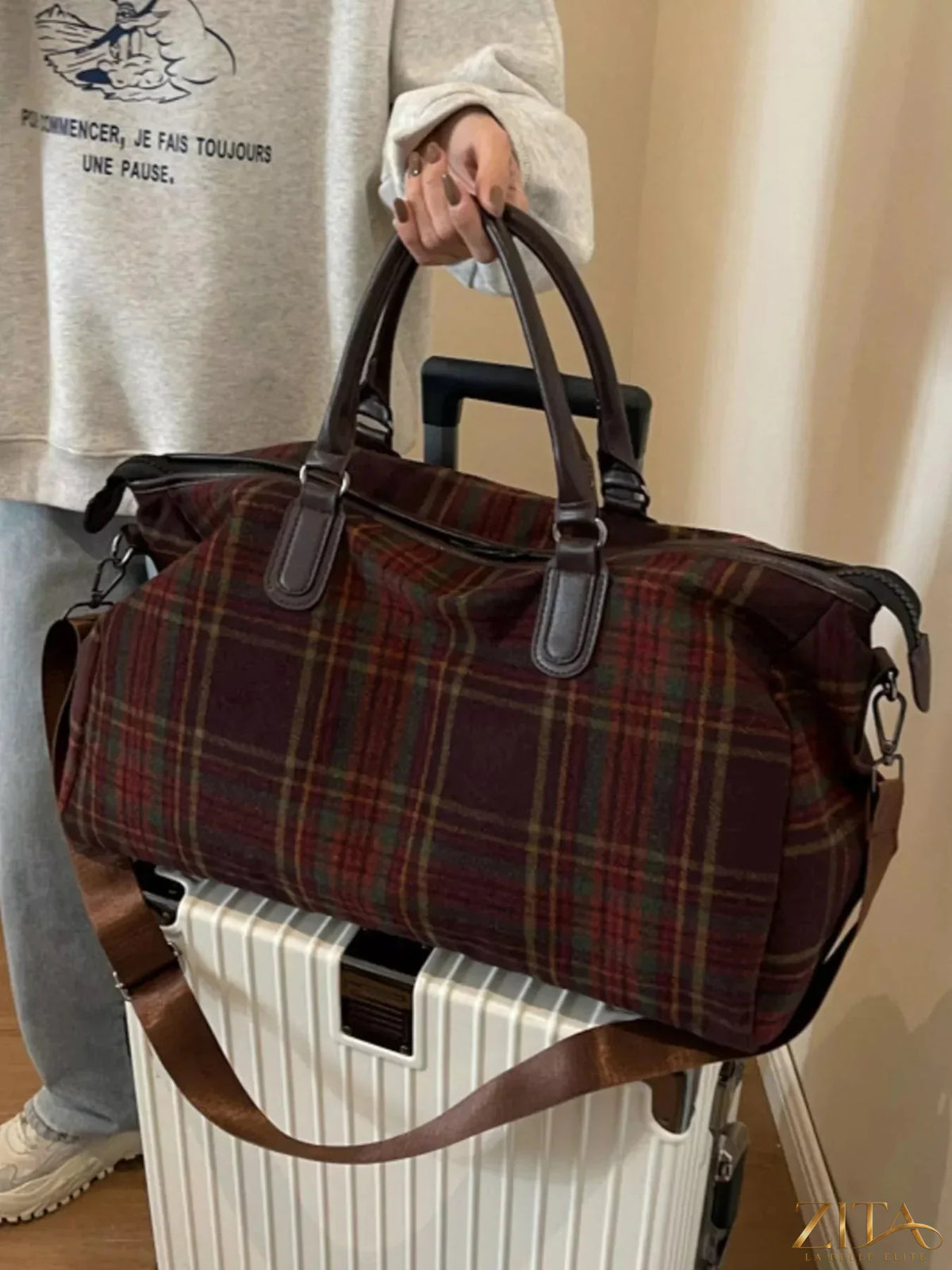 Vintage plaid pattern travel bag by Zita La Belle Elite with leather accents and sturdy handles, ideal for weekend trips.