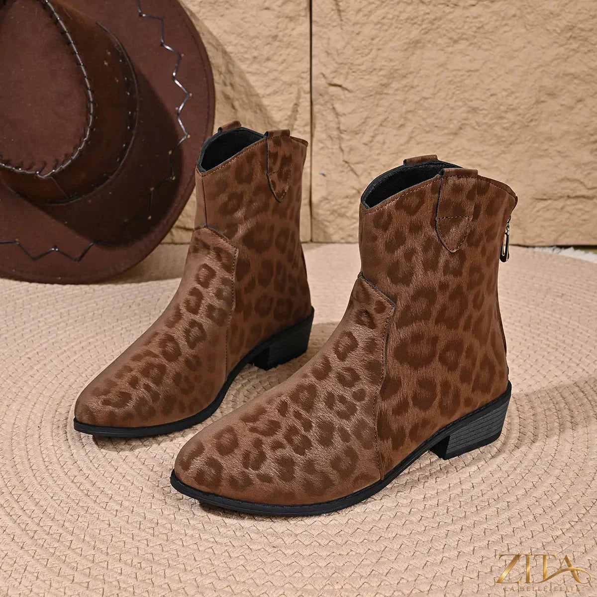 Leopard print Western ankle boots from Trendsi featuring a pointed toe, stacked heel, and cowgirl-inspired style.