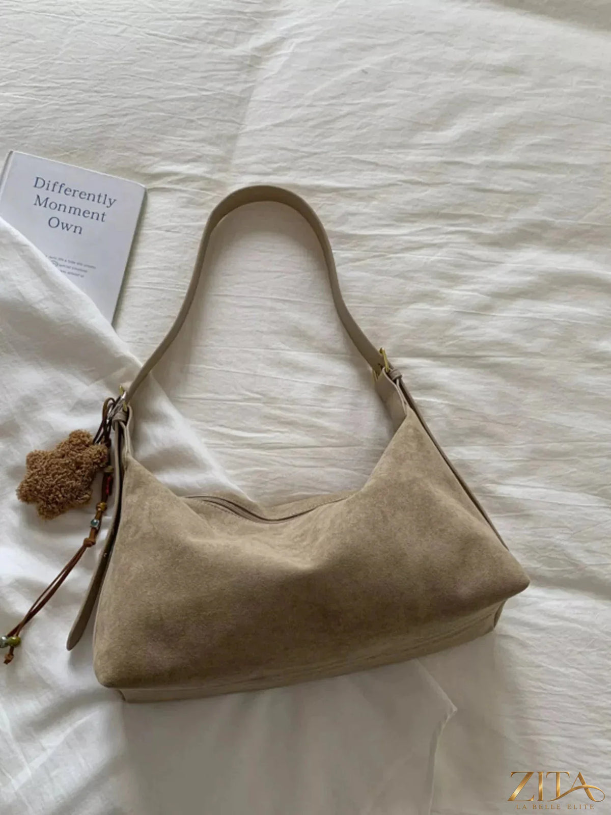 Zita La Belle Elite solid color suede hobo crossbody bag with a relaxed shape and adjustable strap, perfect for casual outings.