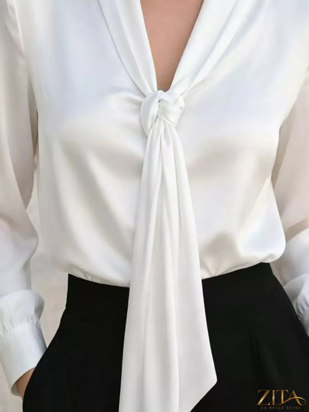 Zita La Belle Elite satin blouse with front tie detail, featuring a smooth fabric and elegant design.