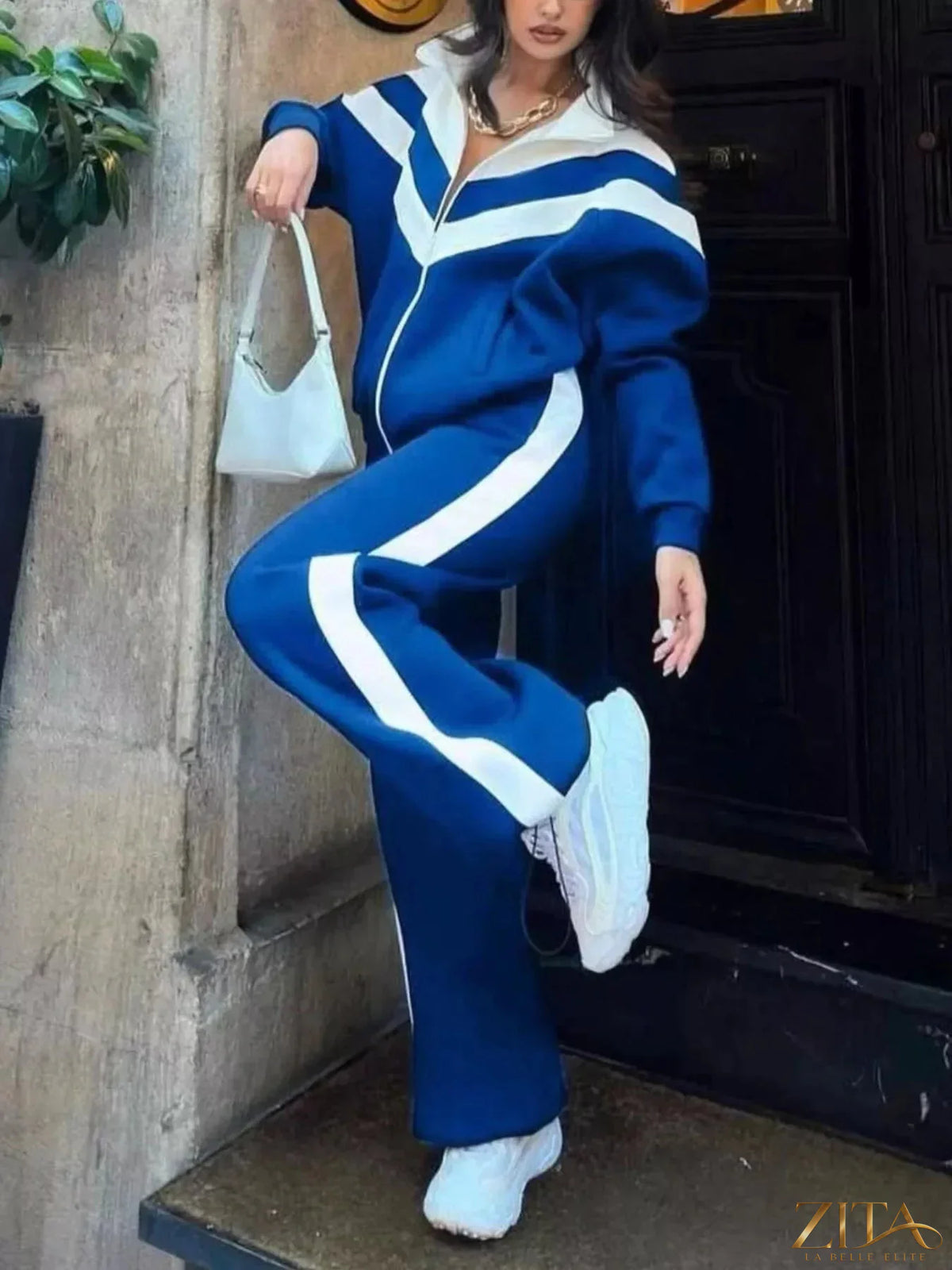Color block zip-up outerwear and pants set by Zita La Belle Elite, featuring vibrant color blocks and comfortable fit.