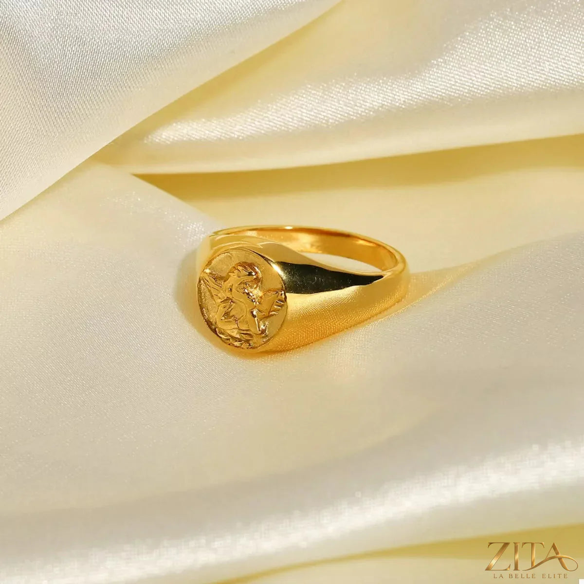 18K gold-plated Cupid ring by Zita La Belle Elite featuring a delicate cupid design on a slender band.