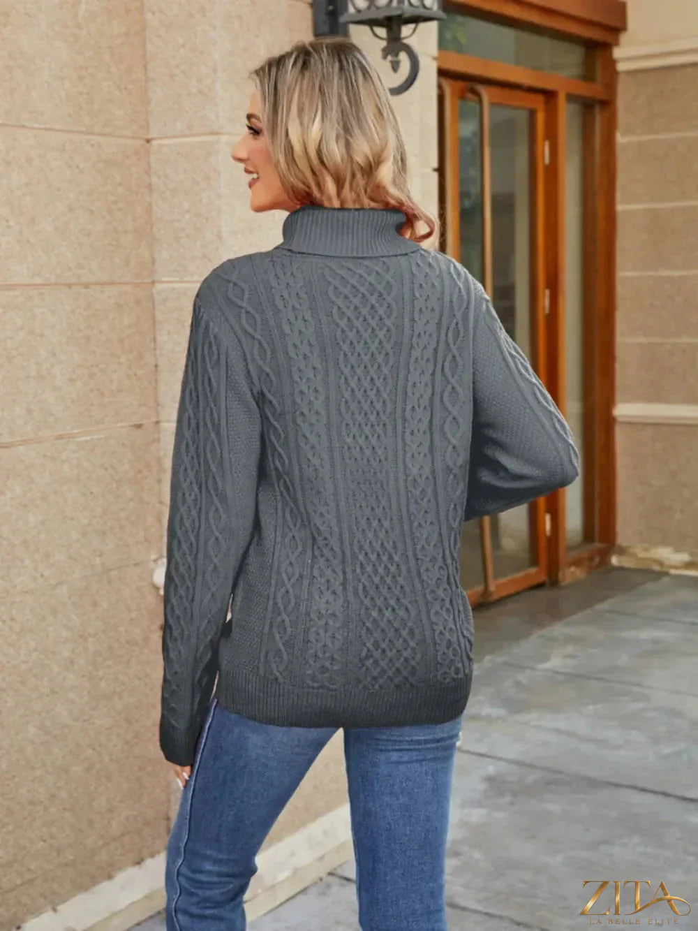 Zita La Belle Elite cable-knit mock neck sweater in cozy, textured knit with ribbed cuffs and hem on a neutral background.