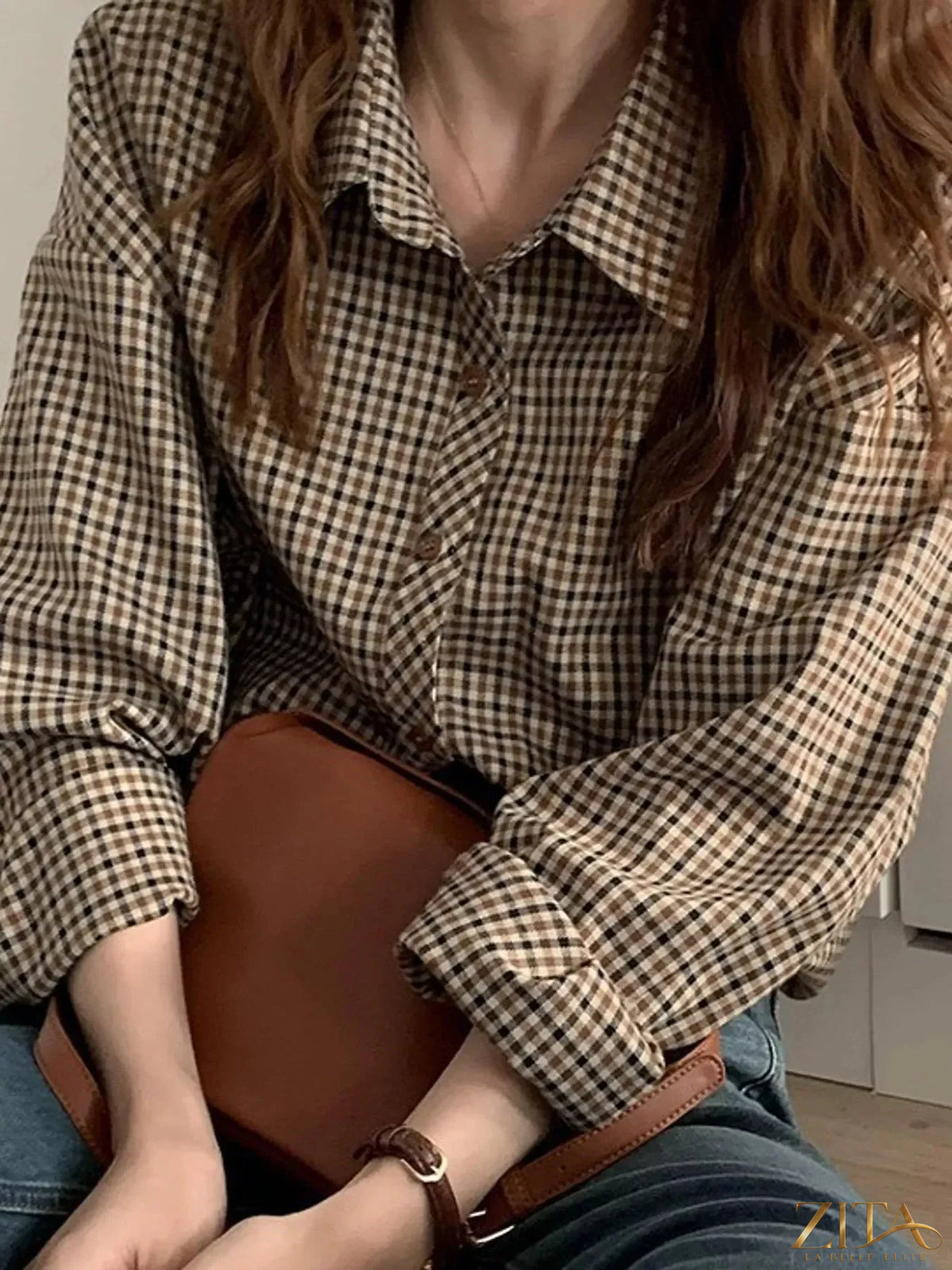 Zita La Belle Elite plaid button-down shirt featuring a classic checkered pattern and collar, displayed on a hanger.