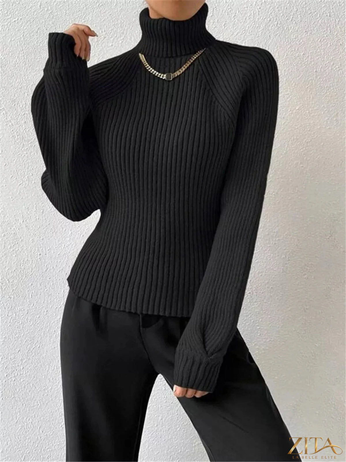 Zita La Belle Elite ribbed knit turtleneck sweater in neutral color, close-up of textured fabric and high neckline.