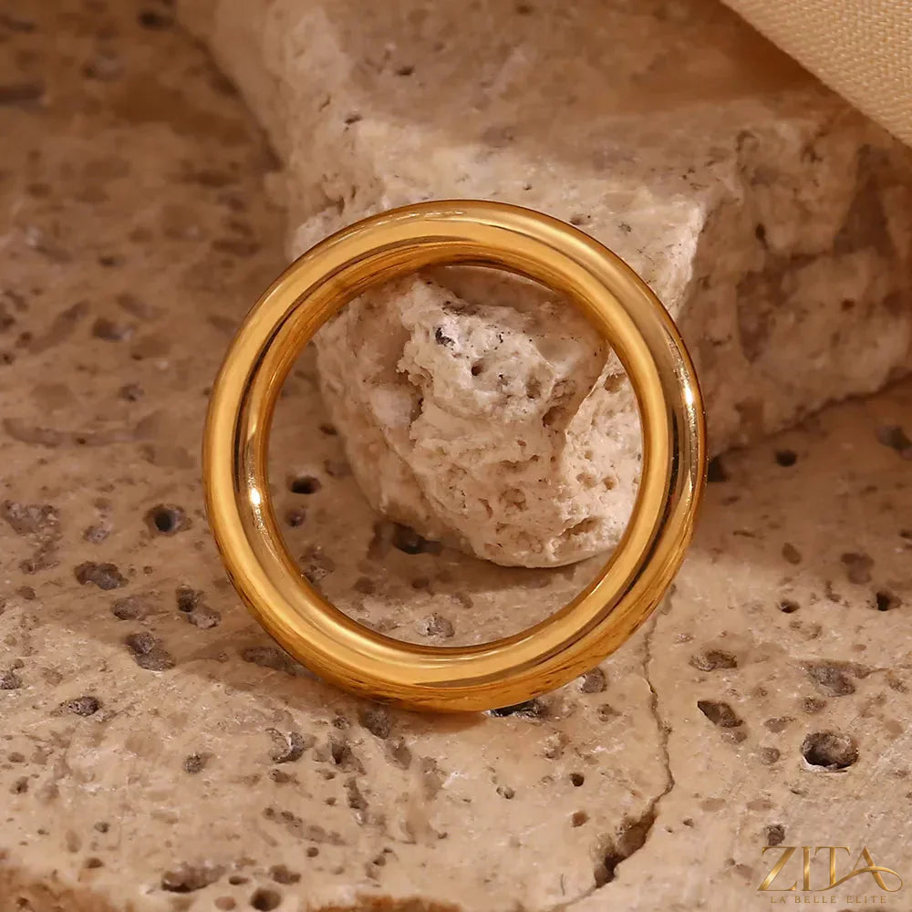 Three-piece stainless steel zircon rings set by Zita La Belle Elite, showcasing polished bands with sparkling zircon stones.