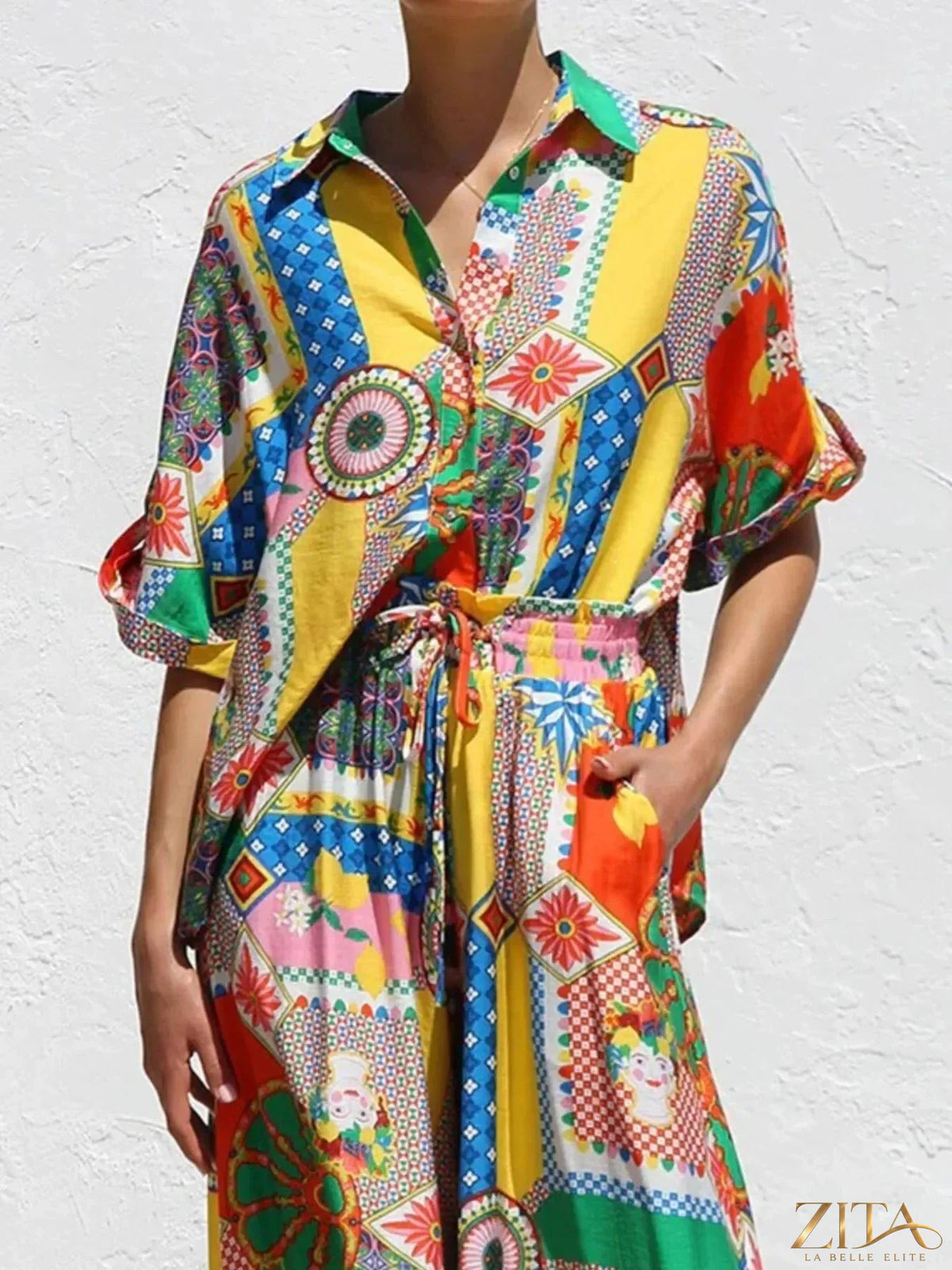 Printed button-up shirt and pants set by Zita La Belle Elite, featuring a stylish matching design and classic fit.