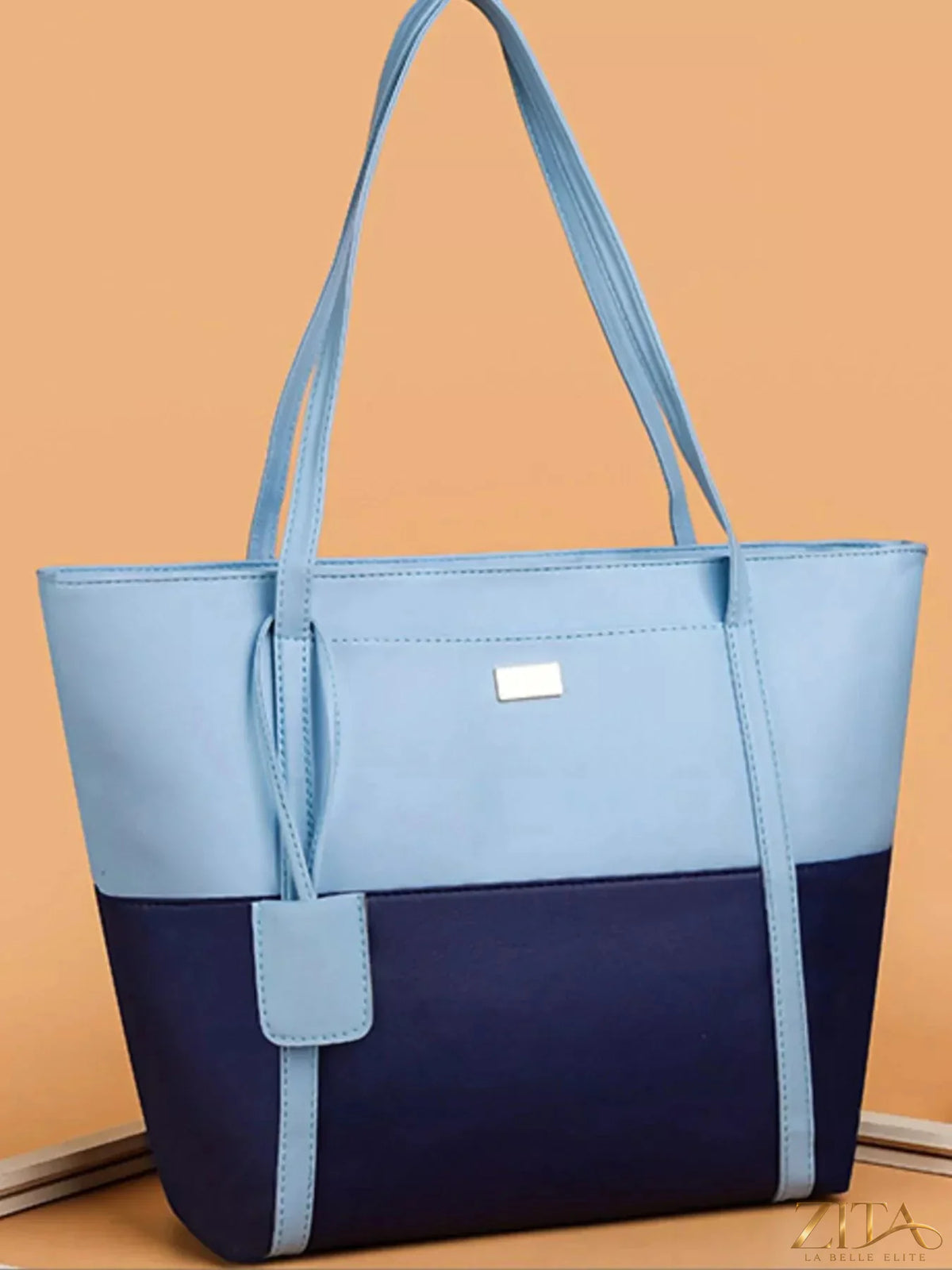 Two-tone tote bag by Zita La Belle Elite featuring a stylish design with dual color panels and sturdy handles.