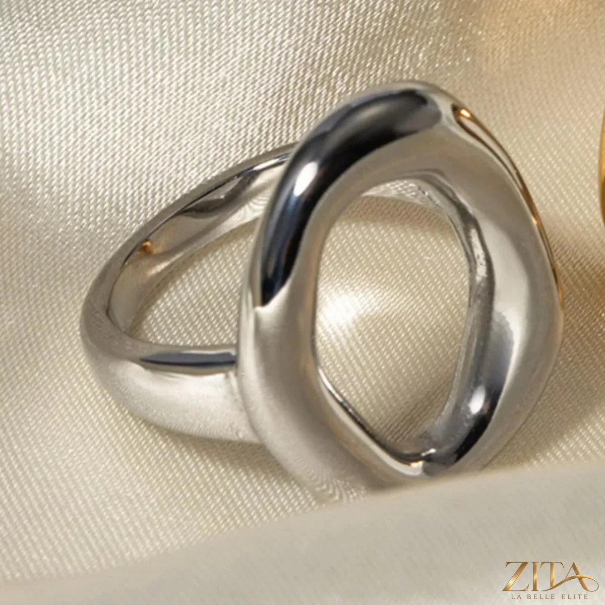 Elegant modern hollow oval ring by Zita La Belle Elite featuring a sleek oval design on a polished band.