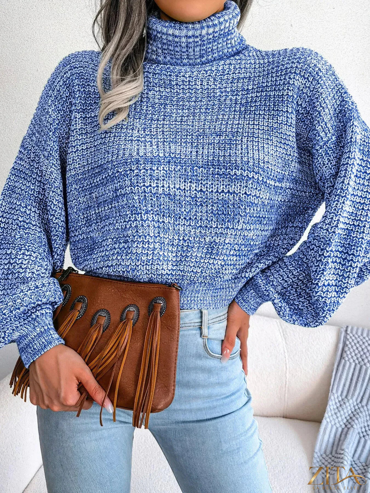 Cream-colored turtleneck dropped shoulder sweater by Trendsi, featuring a cozy knit fabric and relaxed fit.