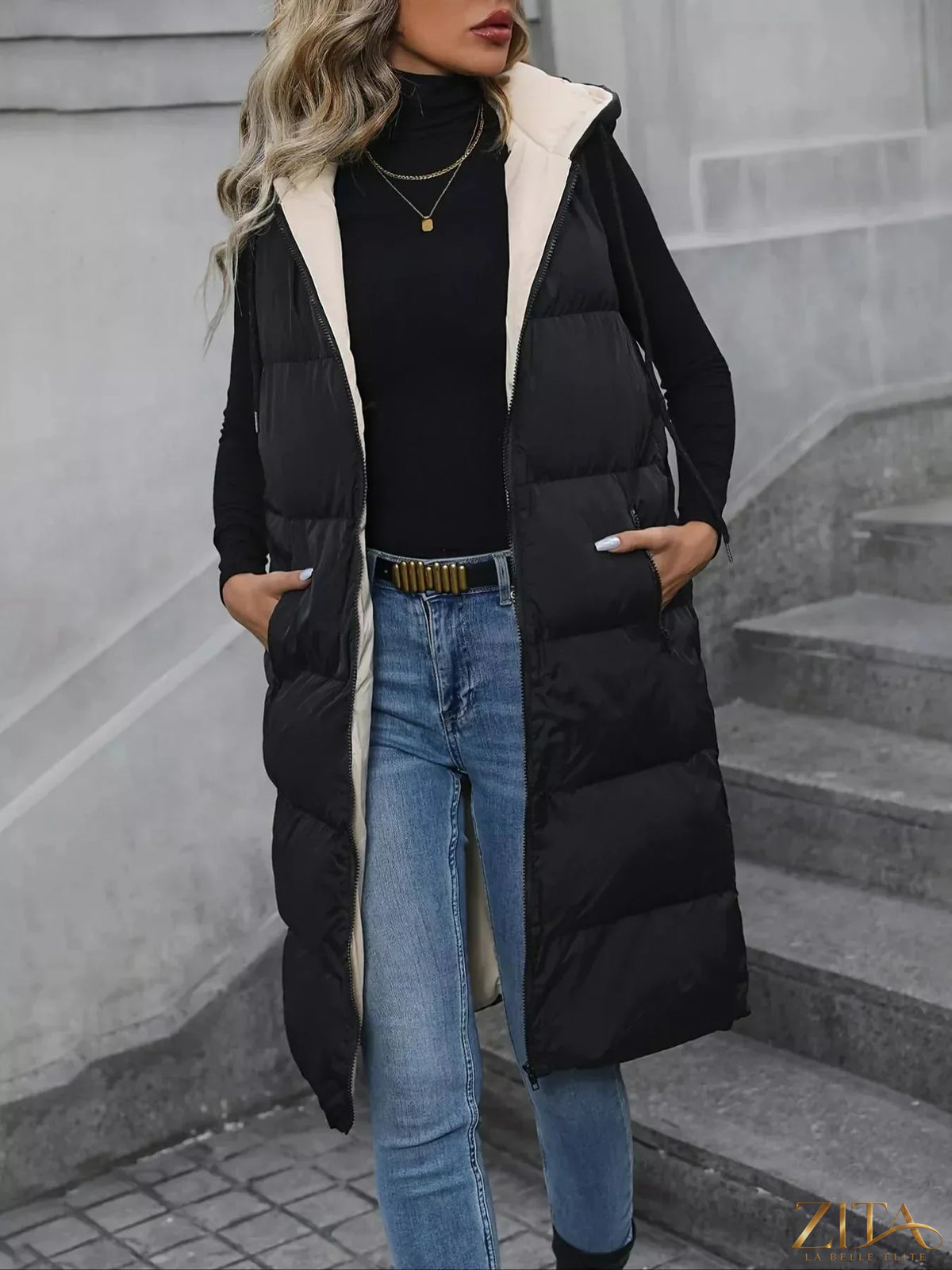 Longline padded hooded vest coat by Zita La Belle Elite, shown with a quilted design and adjustable hood for warmth and style.