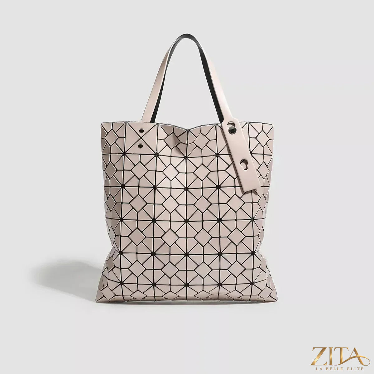 Zita La Belle Elite geometric lattice pattern handbag with structured design and top handle, showcasing intricate cut-out details.