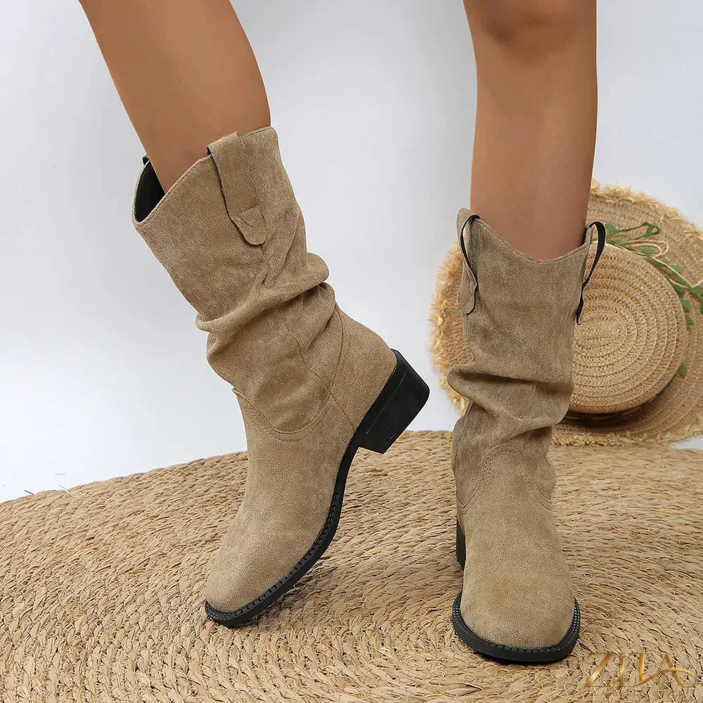 Western cowboy boots with pleated pull-on design, trendy Trendsi brand, featuring classic leather look and pointed toe style.