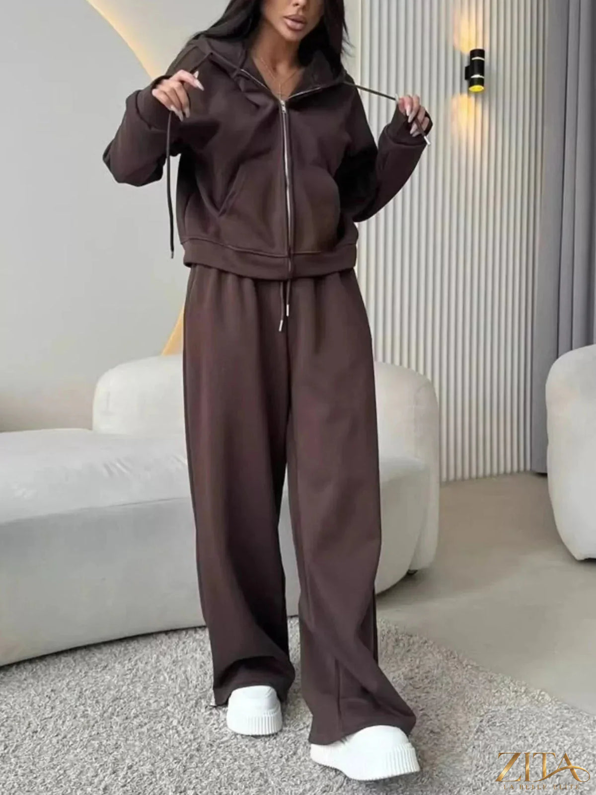 Zita La Belle Elite zip-up hoodie and wide-leg pants set in soft fabric, shown in a casual indoor setting.