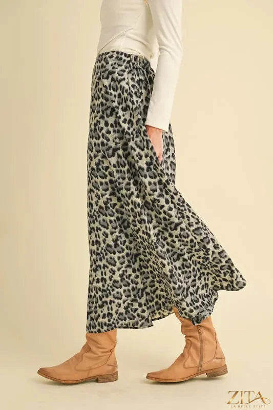 Aemi+Co leopard print midi skirt featuring a flowy silhouette and trendy design, perfect for stylish casual or dressy wear.