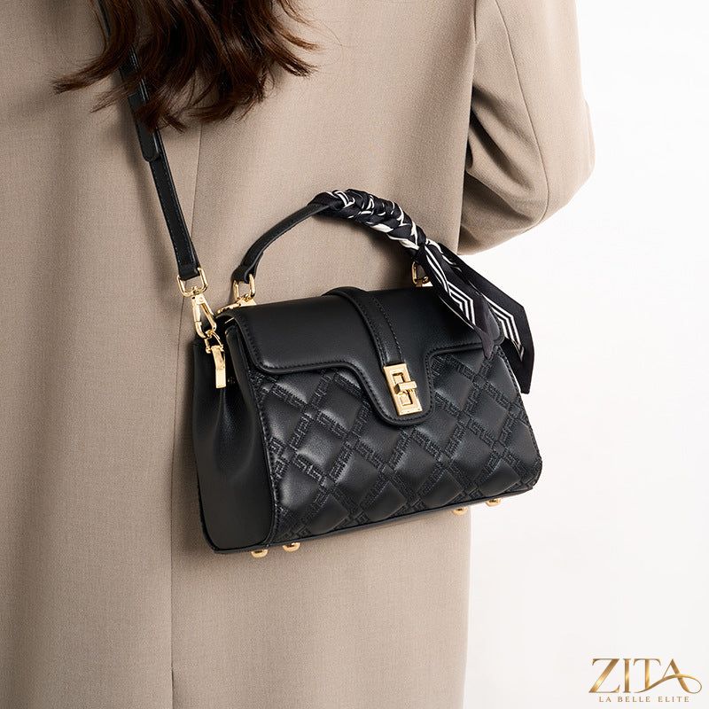 Quilted leather crossbody bag by Trendsi featuring a sleek design, adjustable strap, and stylish quilted pattern.