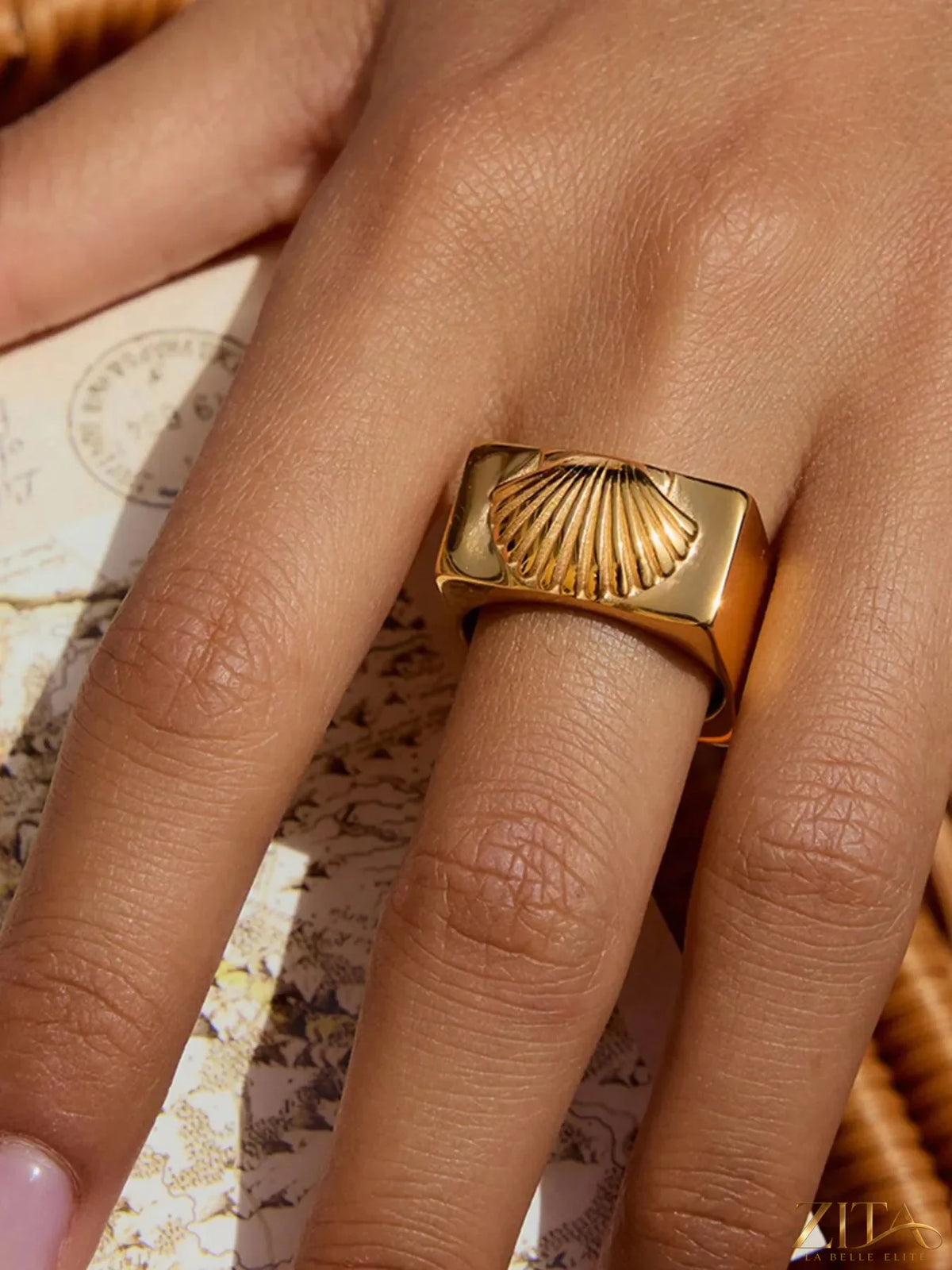 Vintage shell pattern gold signet ring by Zita La Belle Elite, featuring intricate shell design on polished gold band.