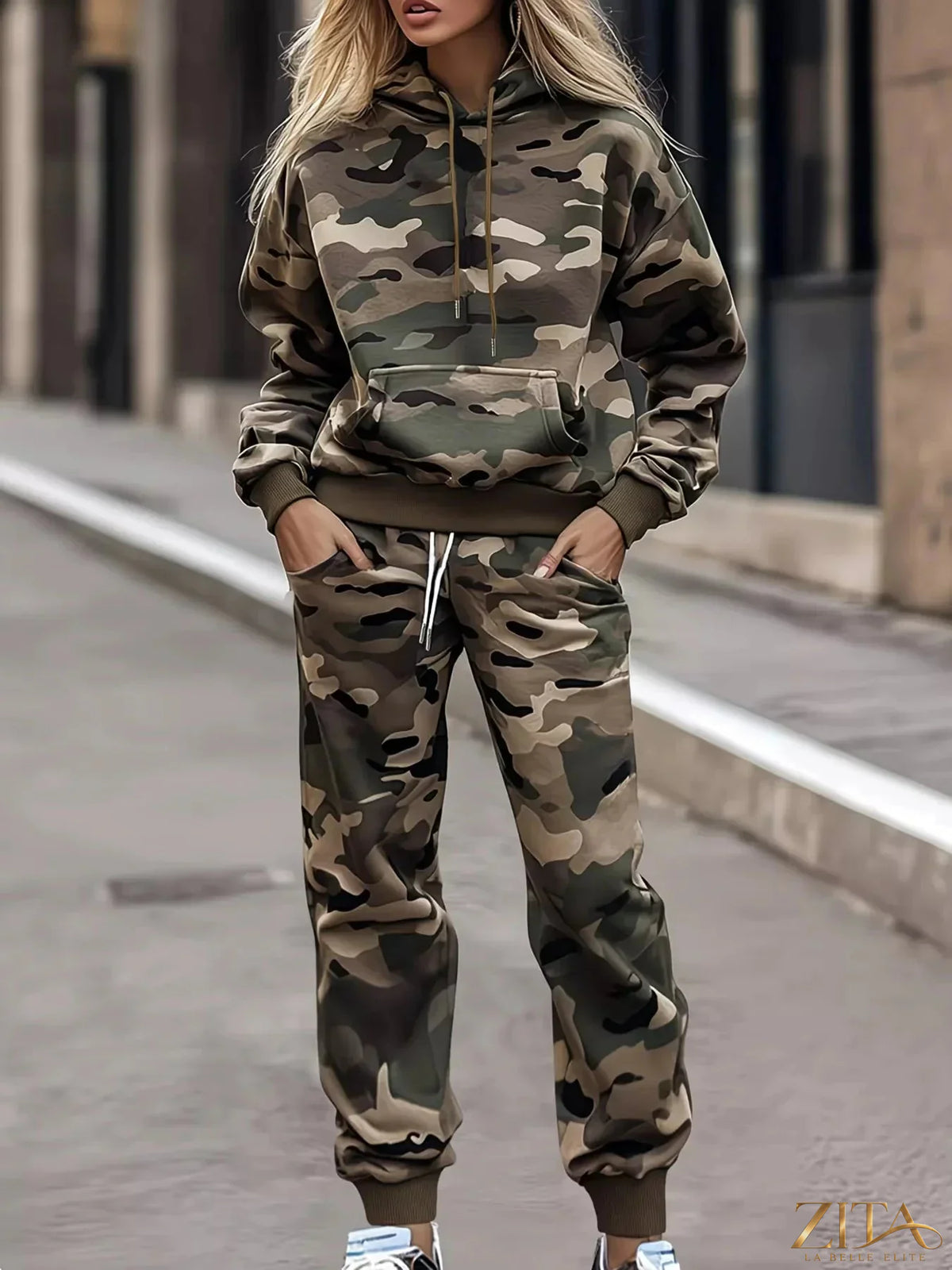 Camouflage print hoodie and joggers two-piece set by Trendsi, casual loungewear with a matching camouflage pattern.