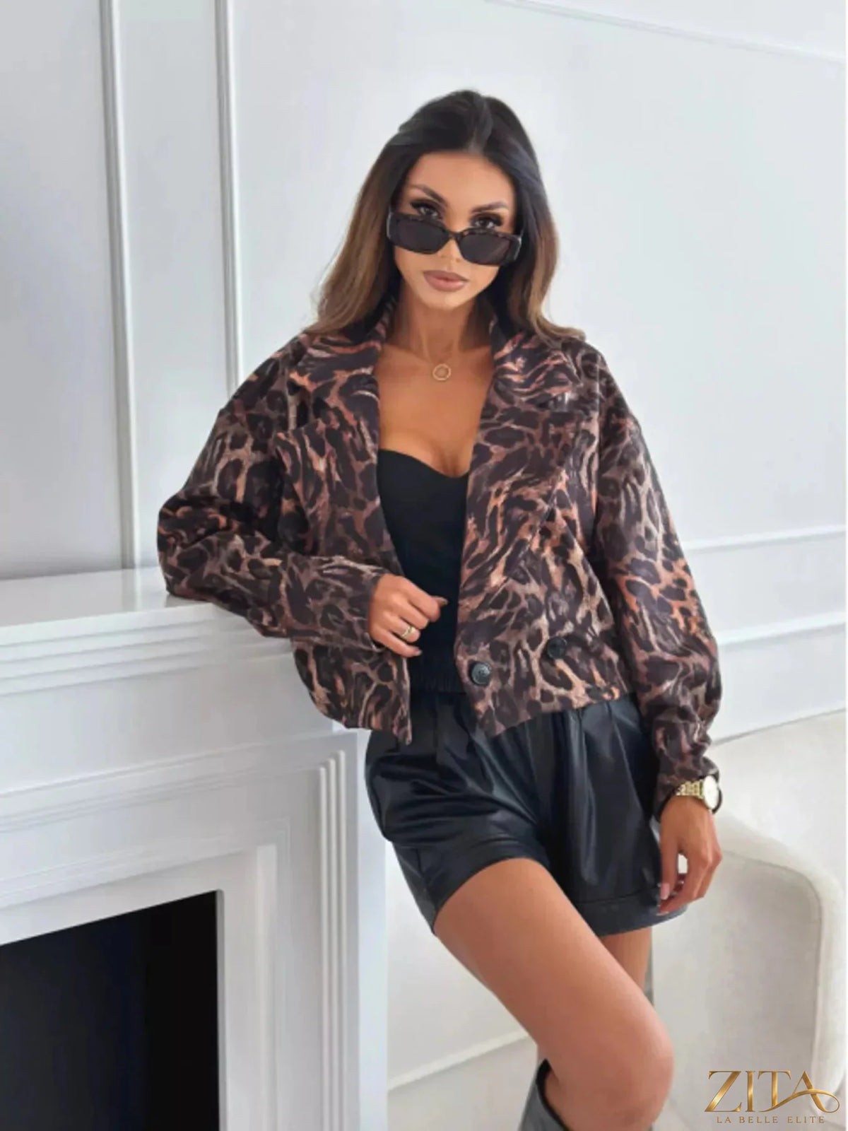 Leopard print cropped blazer by Zita La Belle Elite, shown on a model, featuring fitted style and bold animal print fabric.
