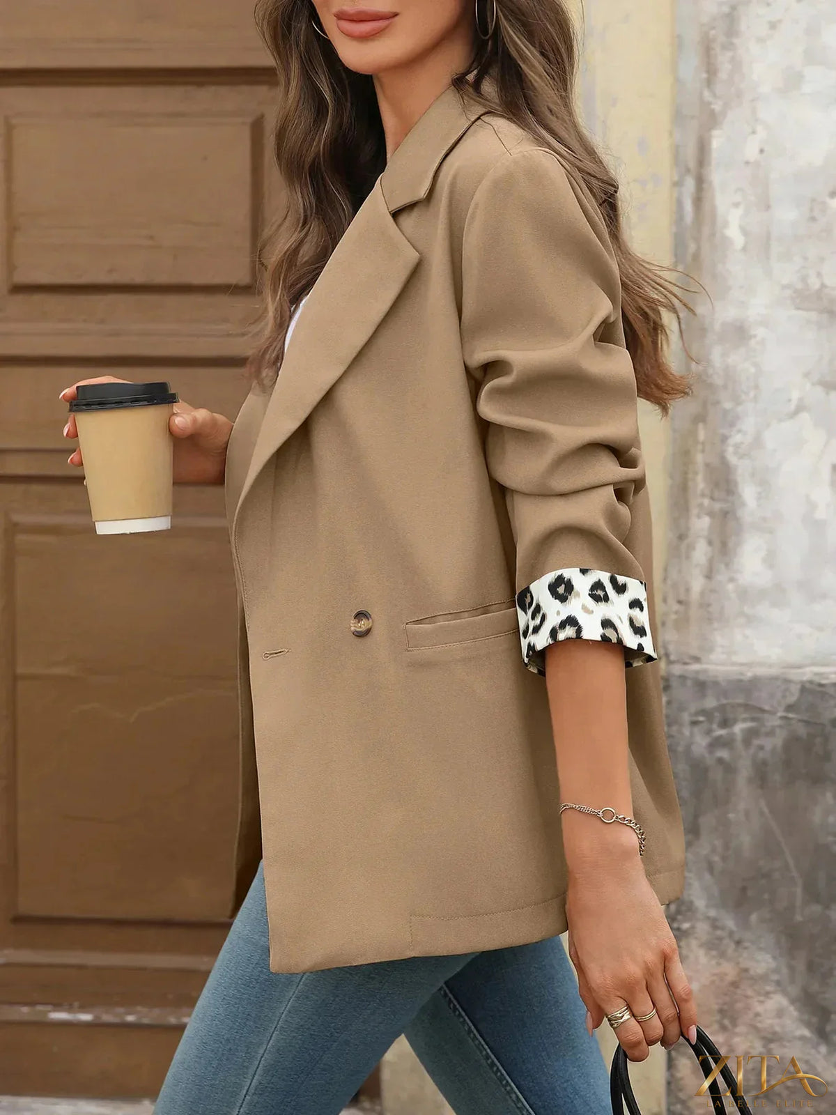 Zita La Belle Elite leopard cuff blazer with lapel collar, long sleeves, stylish design, and animal print fabric.