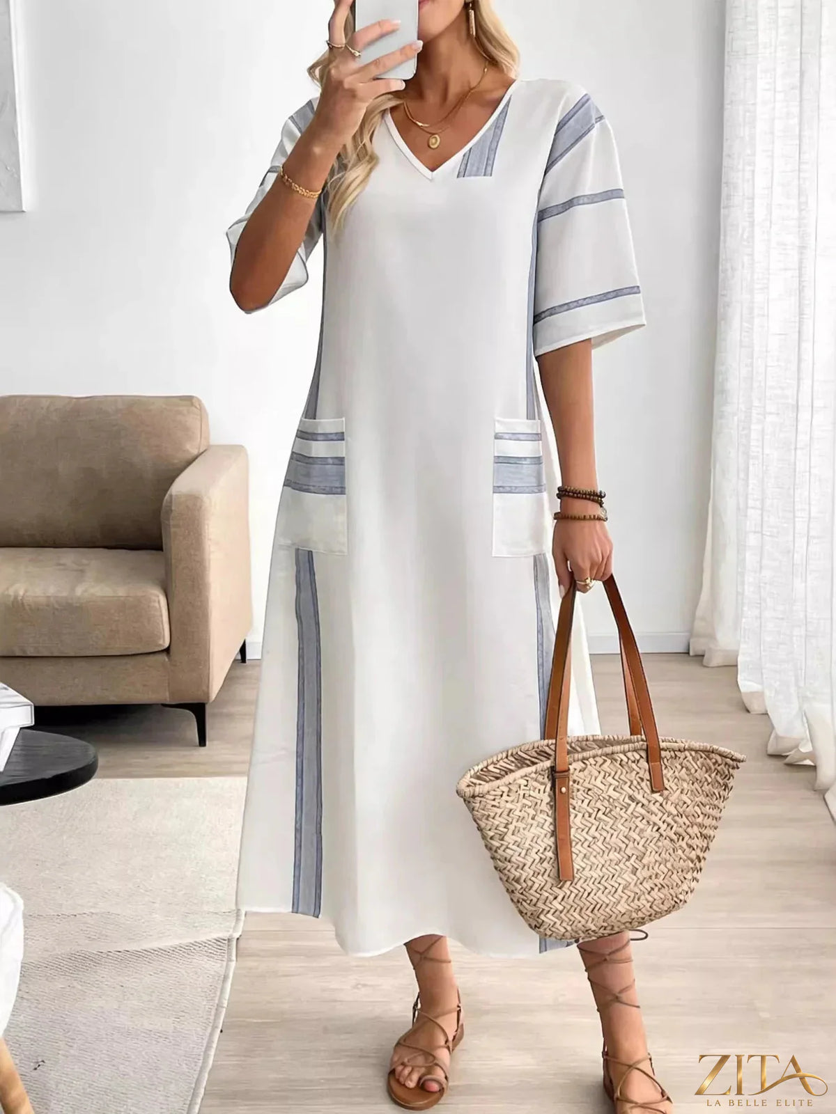 Zita La Belle Elite striped V-neck maxi dress featuring bold horizontal stripes and a flowing silhouette on a white background.