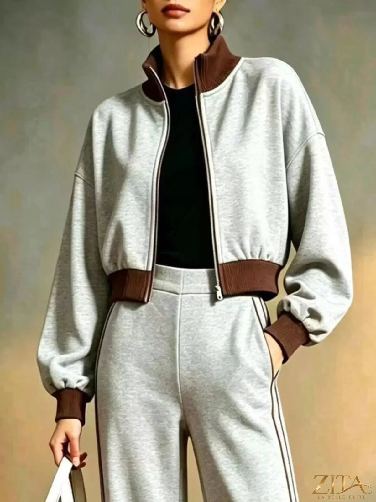 Contrast ribbed jacket and wide-leg pants tracksuit set by Zita La Belle Elite, shown in a stylish, coordinated athletic wear outfit.