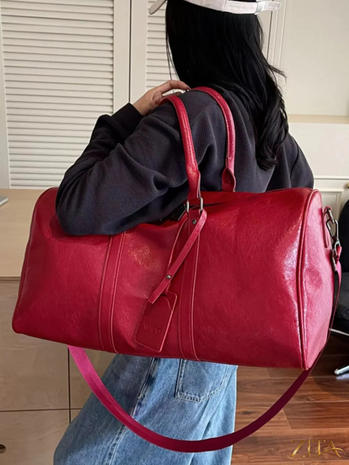 Trendsi PU leather duffle bag with adjustable shoulder strap, multiple compartments, and stylish design for travel and gym use.