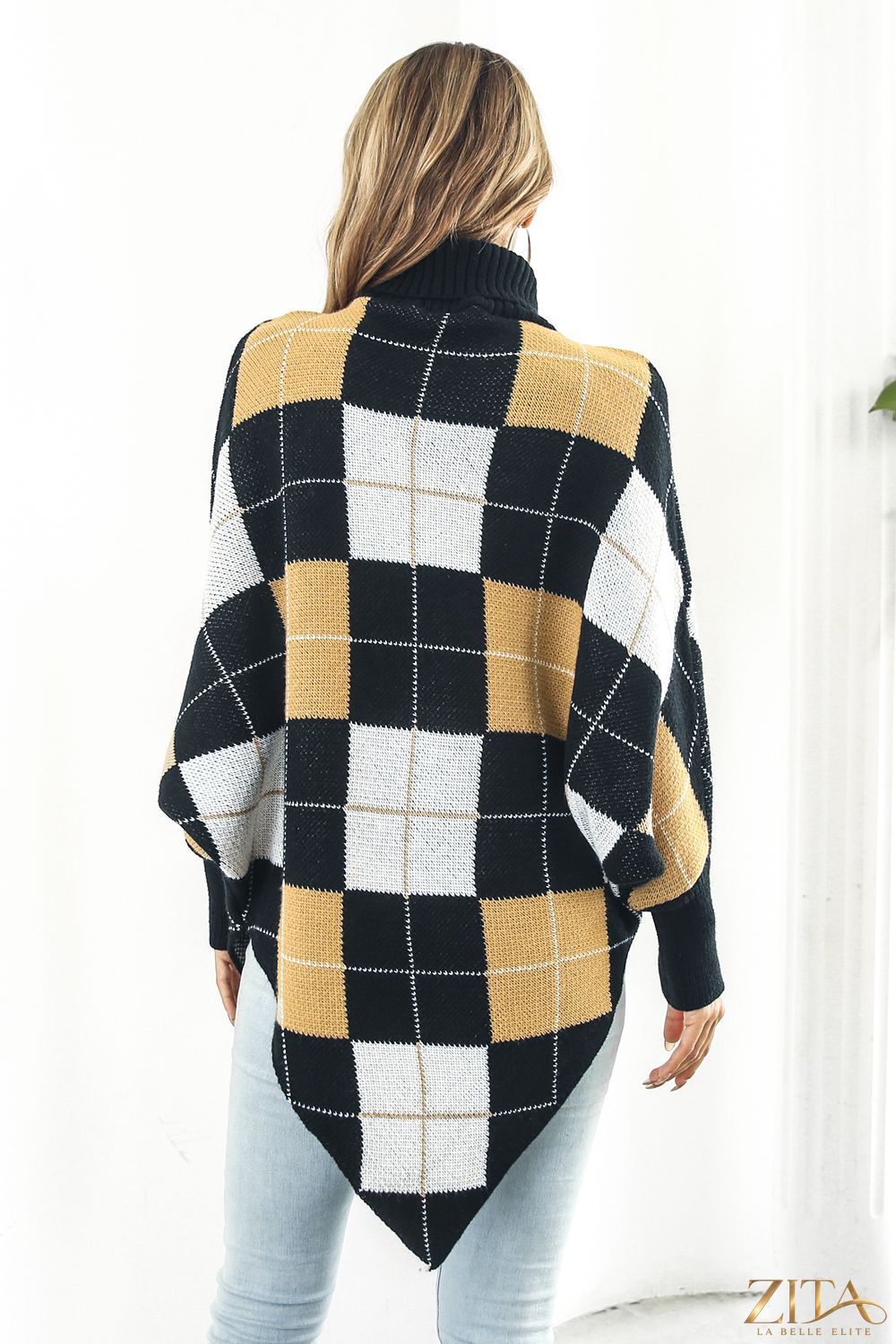 Plaid turtleneck dolman sleeve poncho featuring a cozy, oversized fit with warm plaid pattern and stylish design.