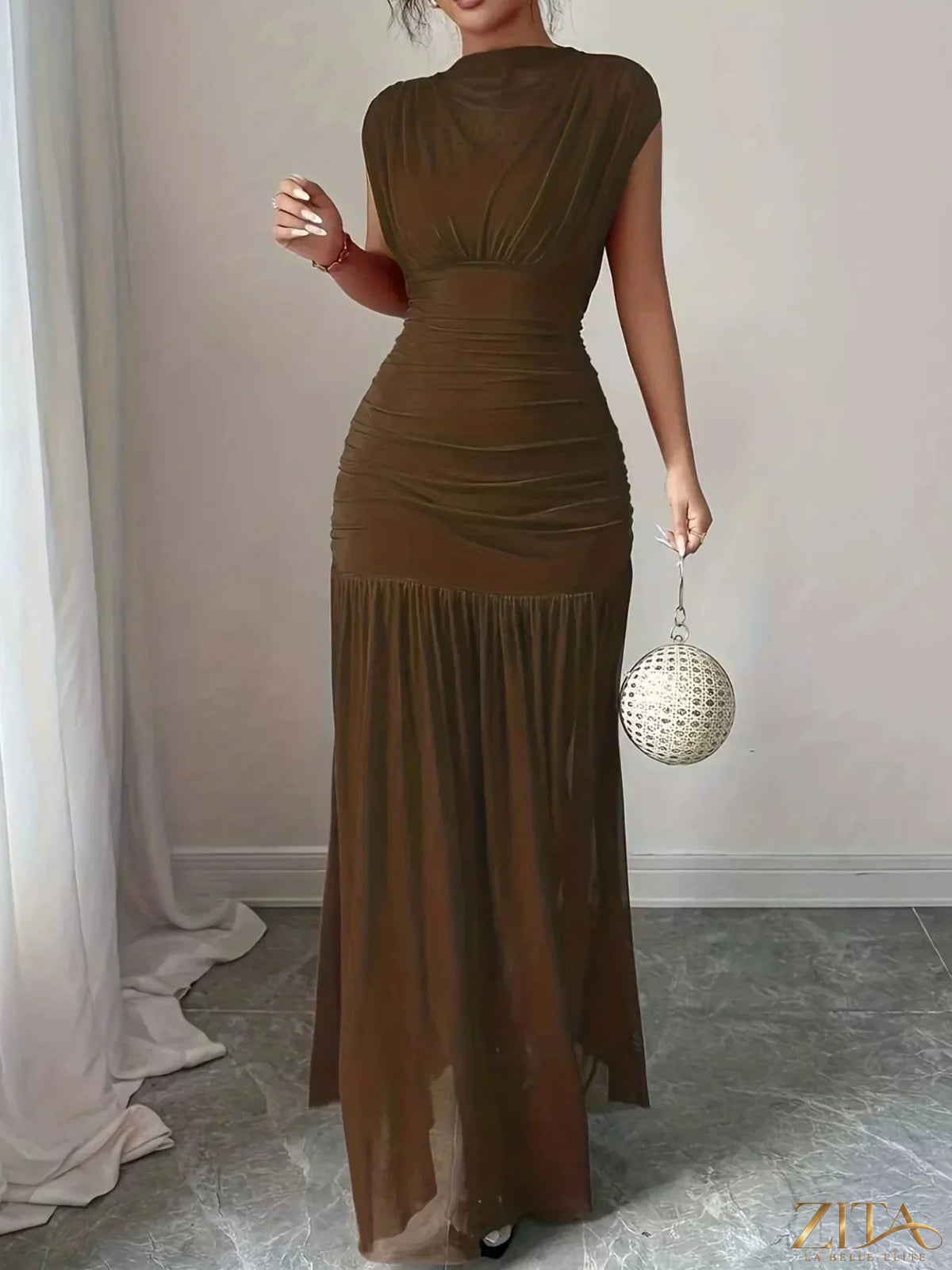 Zita La Belle Elite ruched black bodycon maxi dress displayed on a hanger, showcasing fitted silhouette and elegant design.
