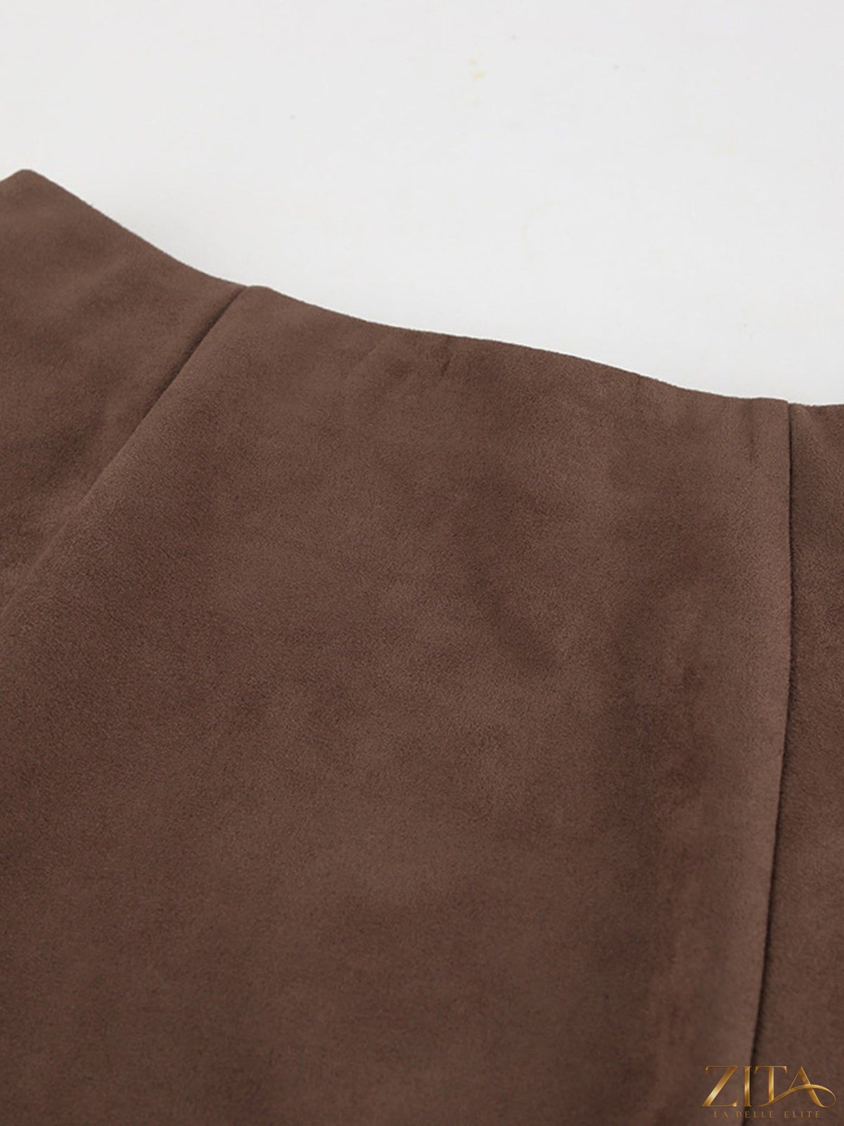 Brown suede midi skirt from Trendsi, featuring a flowy silhouette and smooth texture, perfect for casual or dressy outfits.