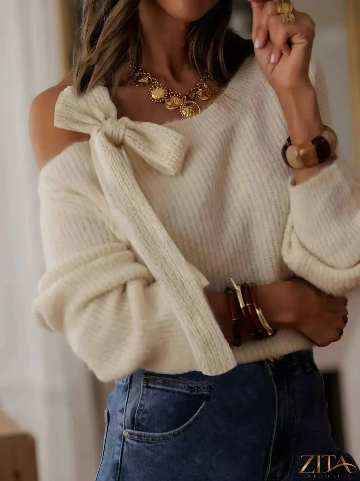 Zita La Belle Elite bow-accent one-shoulder sweater in soft knit fabric, featuring a stylish bow detail on the shoulder.