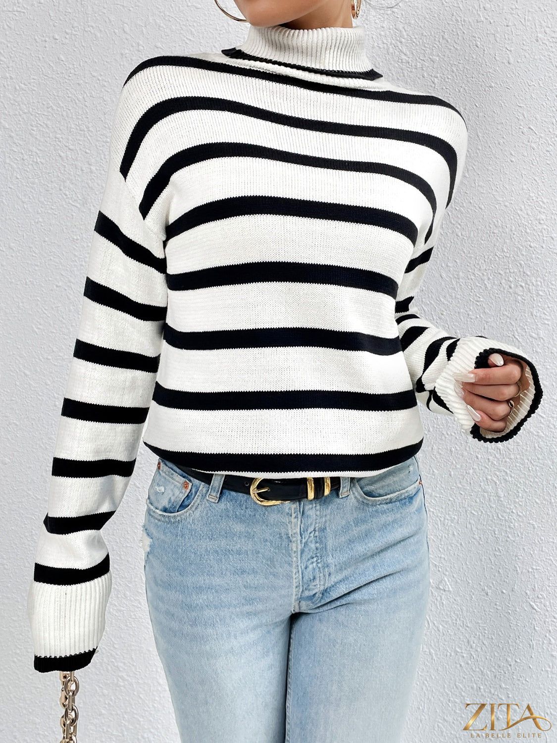 Striped turtleneck drop shoulder sweater by Trendsi, featuring a cozy knit design with bold horizontal stripes and a relaxed fit.