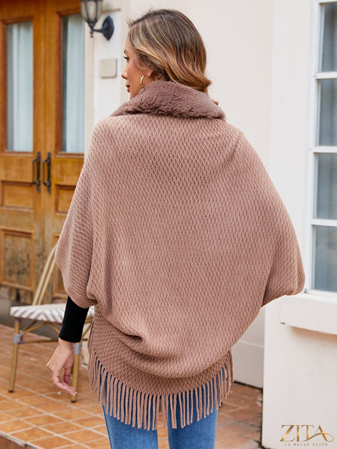 Open front fringe hem poncho from Trendsi with a flowing design and fringe details, perfect for layered fall looks.