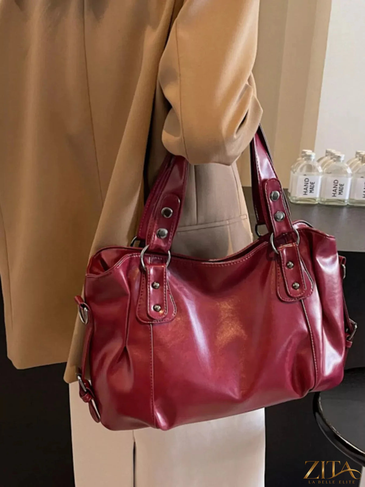 Vintage style leather handbag by Trendsi featuring a classic design with sturdy leather and elegant handles.
