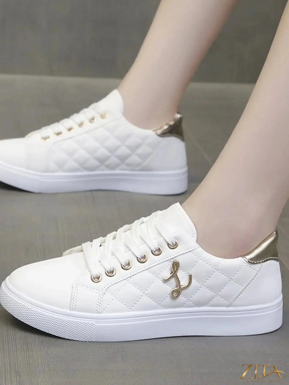 Zita La Belle Elite quilted platform sneakers with metallic gold accents, stylish and padded for comfort and fashion.