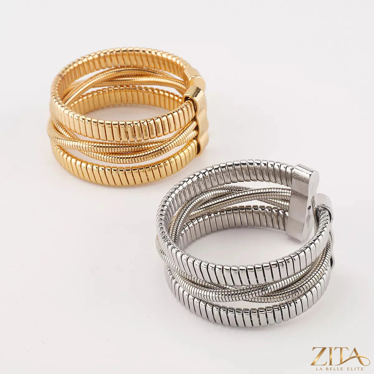 Multi-layered open bracelet by Zita La Belle Elite featuring delicate gold-tone chains and elegant design.