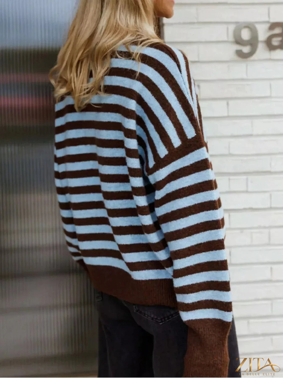 Striped crew neck sweater by Trendsi featuring horizontal navy and white stripes, long sleeves, and a comfortable fit.