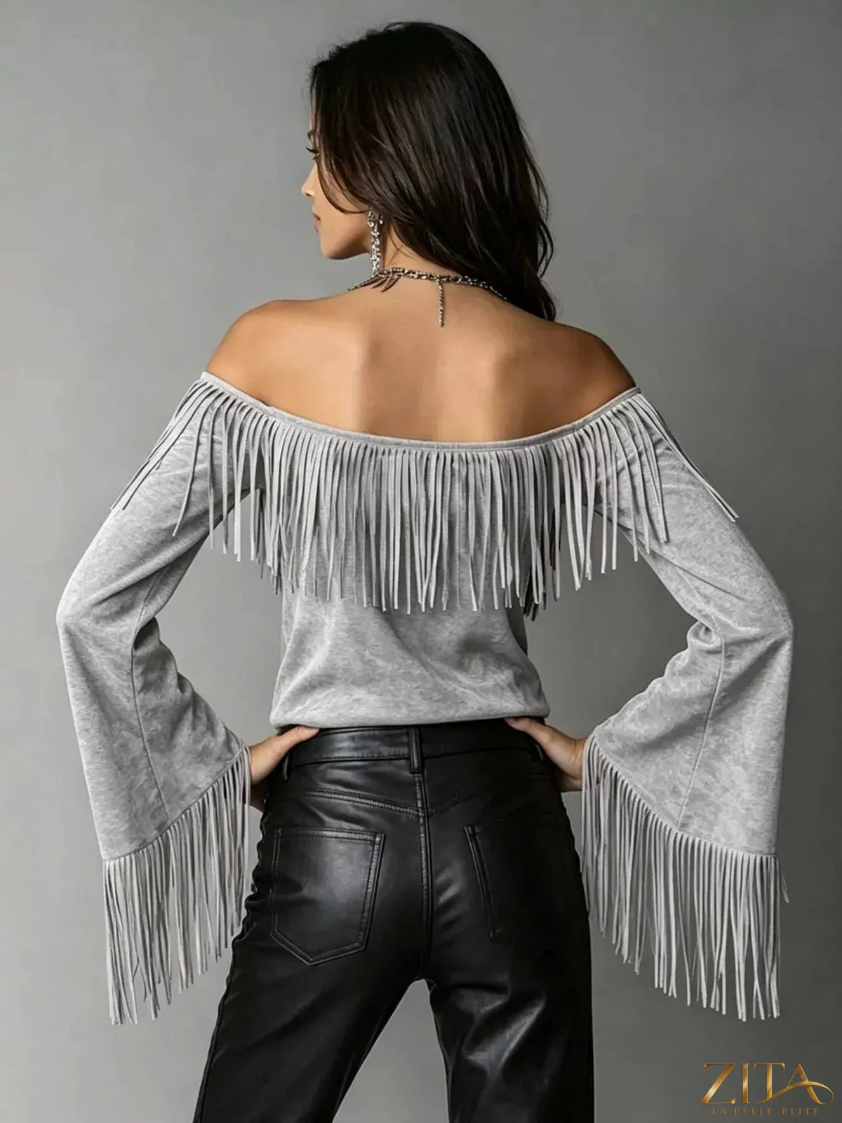 Plus size fringed off-shoulder T-shirt from Trendsi with a full size fit, featuring a stylish fringed neckline and casual design.