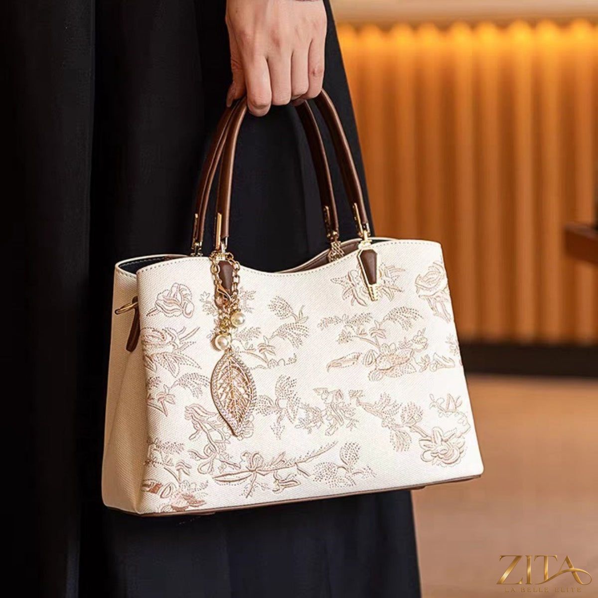 Zita La Belle Elite embroidered floral leather handbag with colorful floral embroidery, top handle, and elegant design.